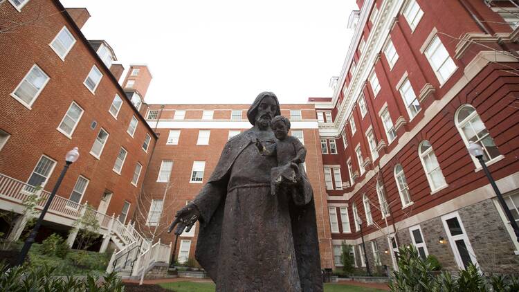 Statue of catholic figure in court yard